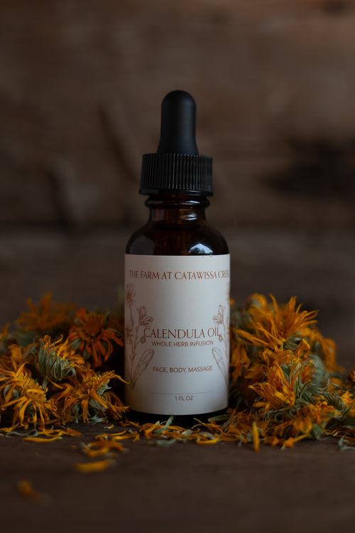 calendula herbal infused oil 1oz glass bottle by The Farm at Catawissa Creek